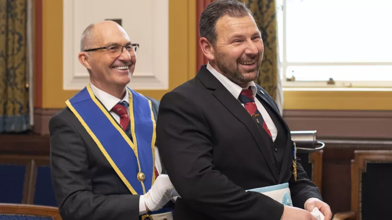 Two members of Freemasonry are getting ready for the Lodge meeting