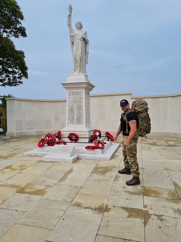 Andy Carter stops at his local cenotaph