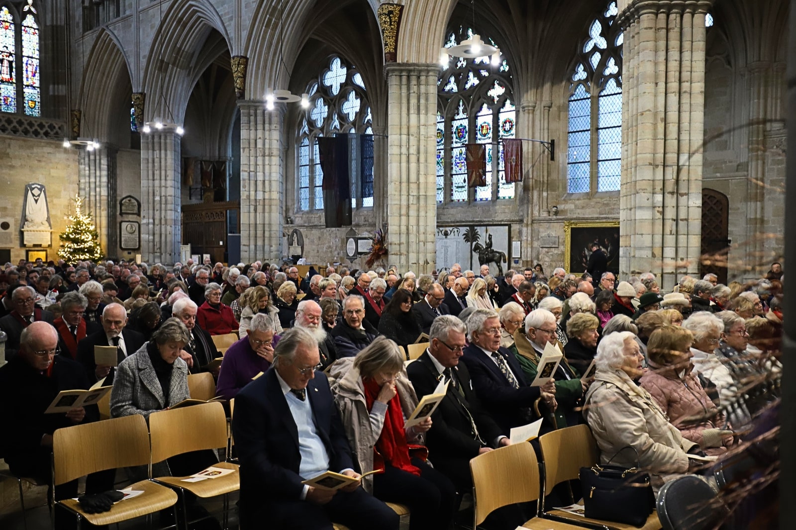 The inside of a cathedral pack with people