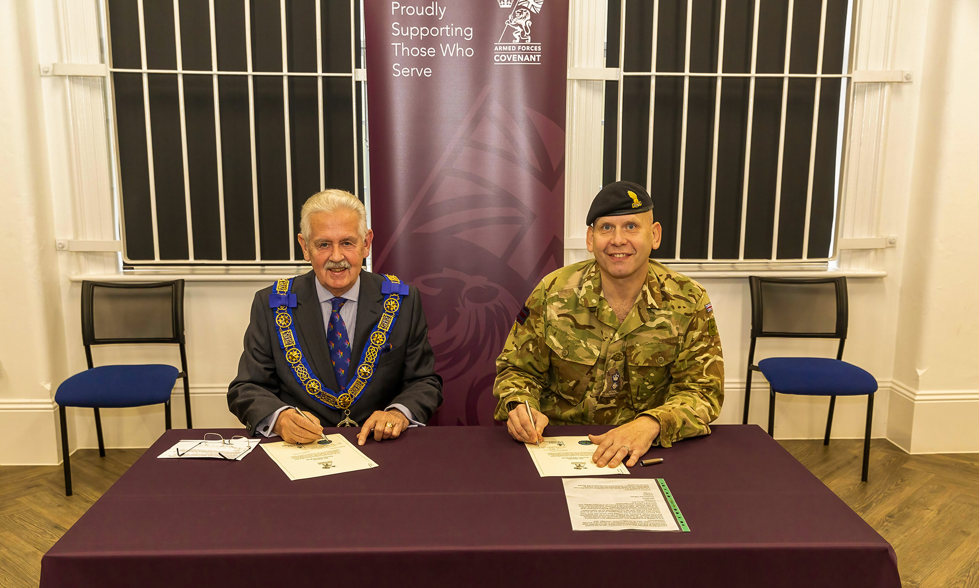 Head of Freemasonry for the Province of East Kent, Neil Hamilton Johnstone, wearing full regalia, and Lieutenant Colonel David Hirst signing the covenant