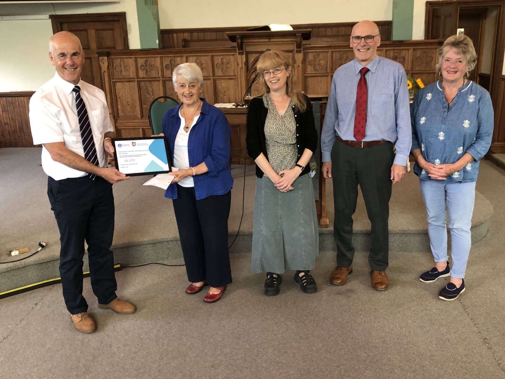 Freemasons presenting a cheque to Dementia Friendly Parishes