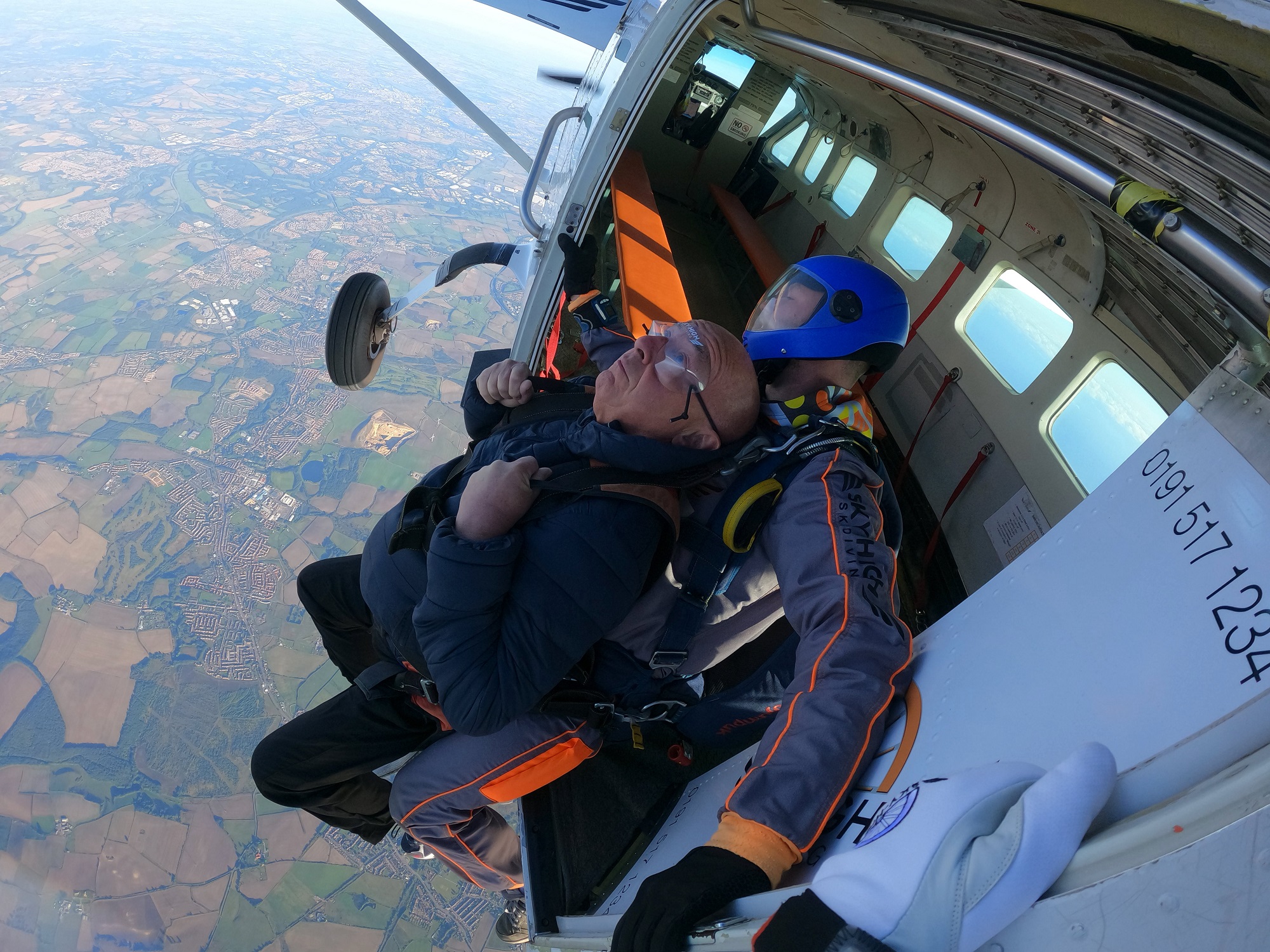 Freemason David Armstrong jumps out of the aircraft with a parachute