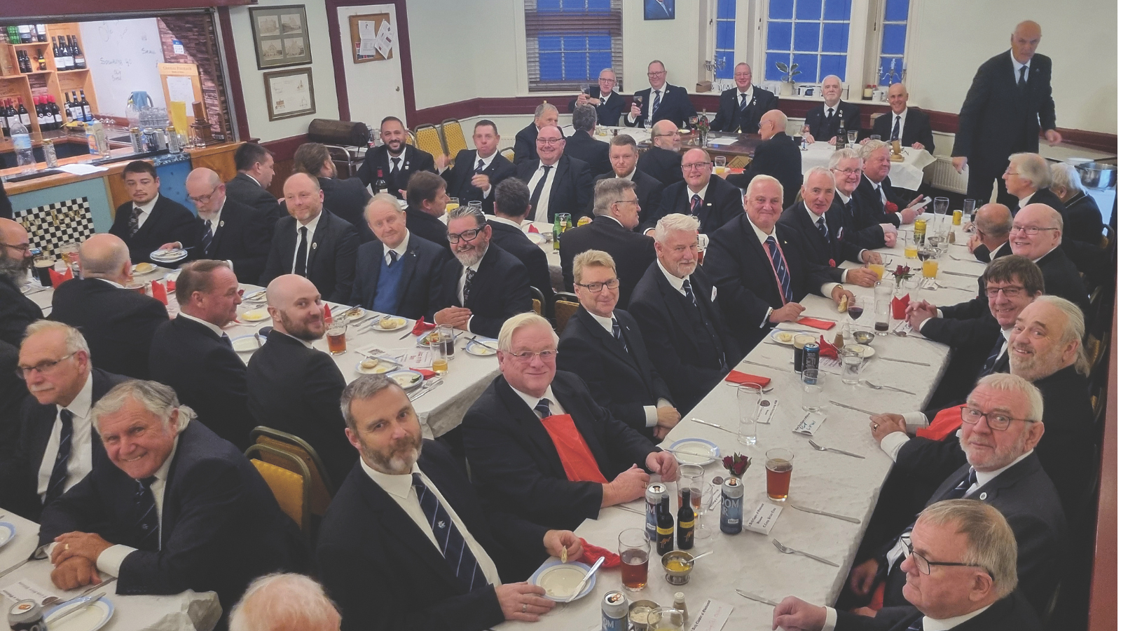 Royal Arch Freemasons dining after a meeting, wearing their suits