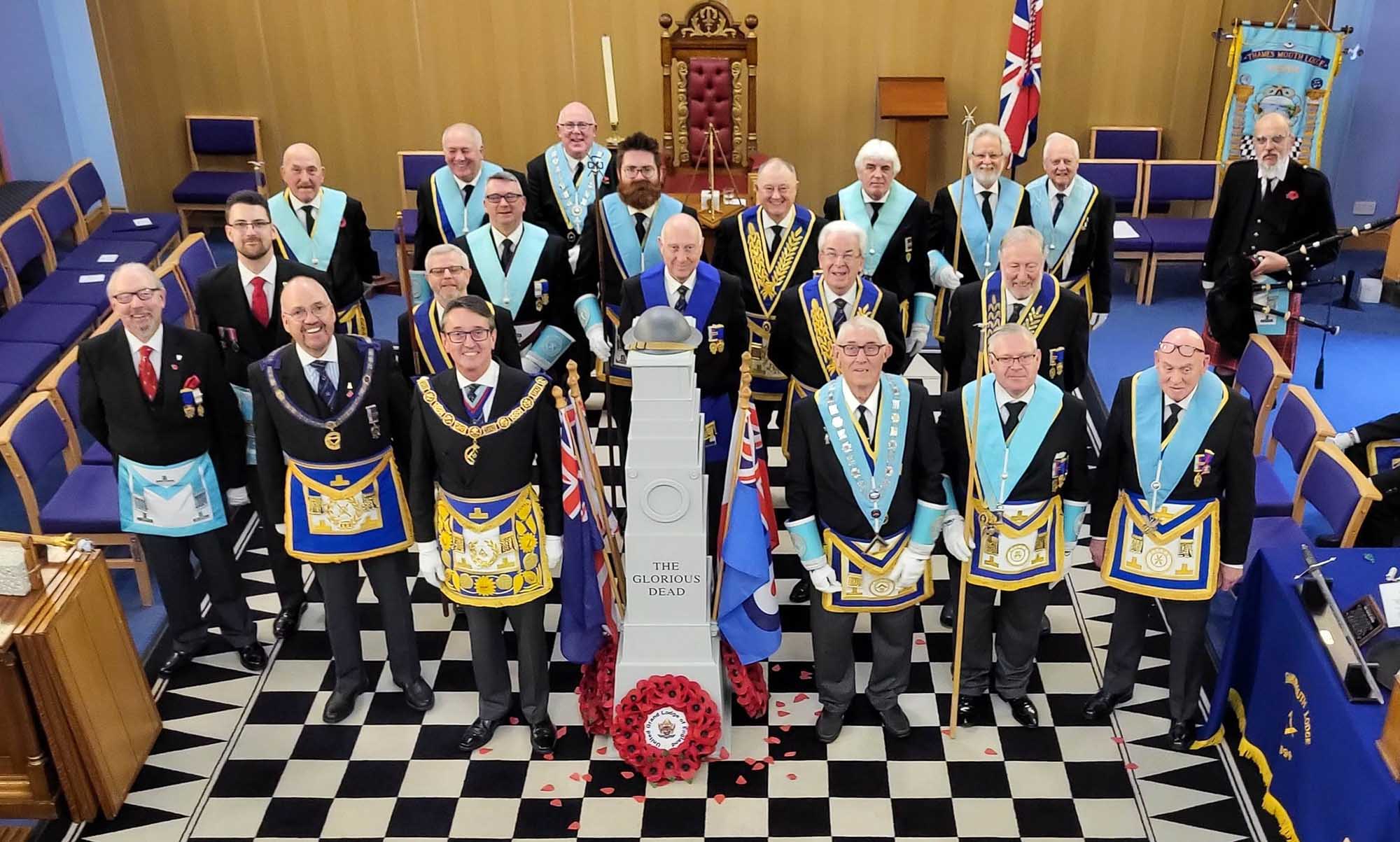 Members of both lodges in full regalia stood either side of the Cenotaph replica