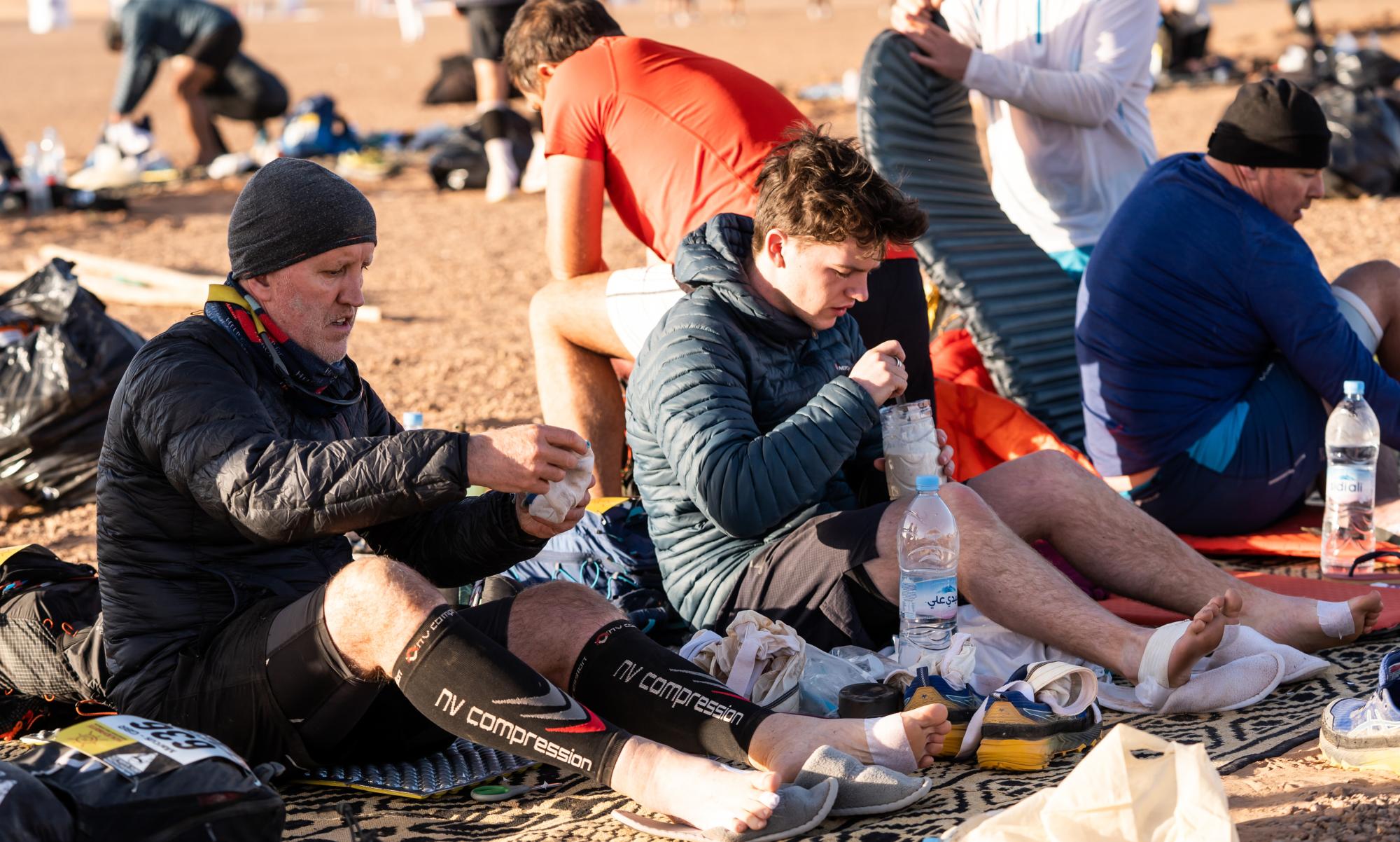 Ian (left) and George are pictured resting at the start of the second day. Picture by curtesy of Ian Corless.