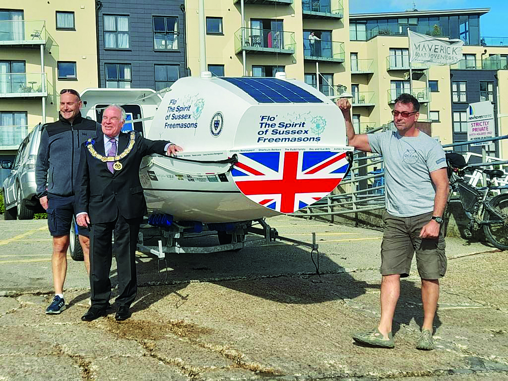 Matt Garman, Neil Furminger and Steve Woolley with the boat the sailed 3000 miles in