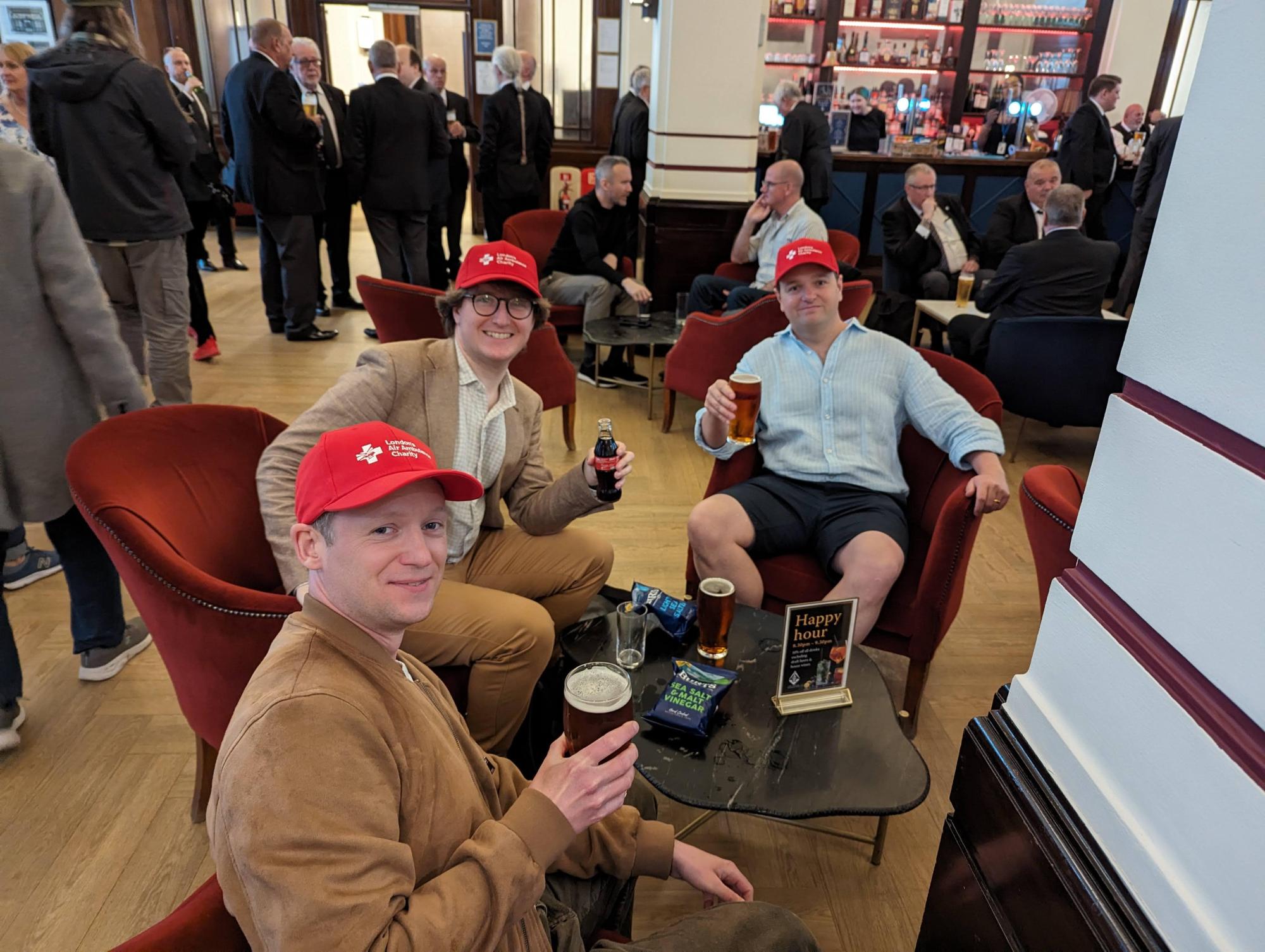 Three Freemasons enjoying drinks at the Café and Bar at Freemasons' Hall in London