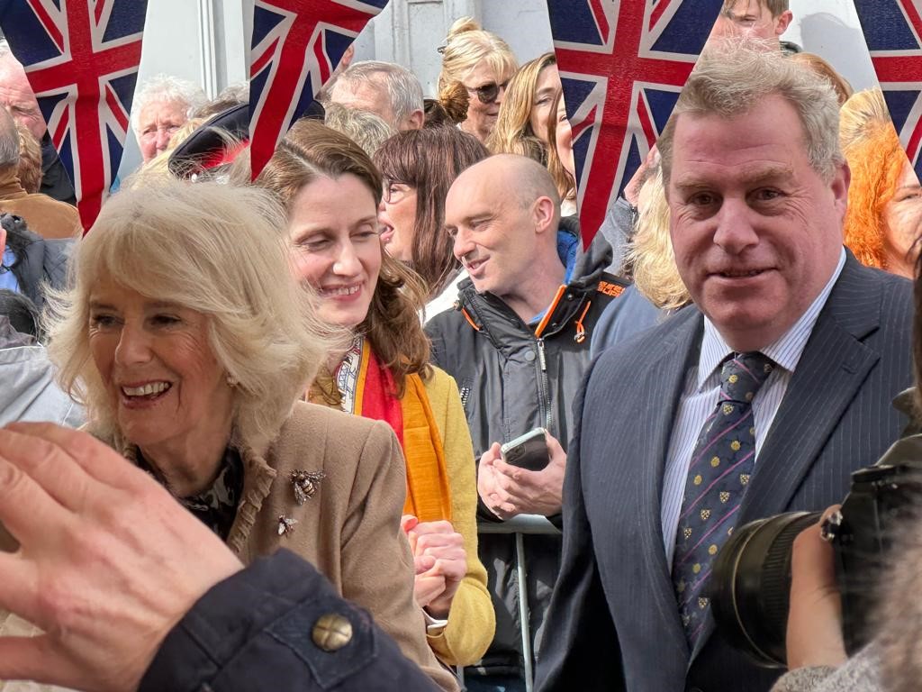 Her Majesty Queen Camilla, being escorted by Freemason Stuart Jones