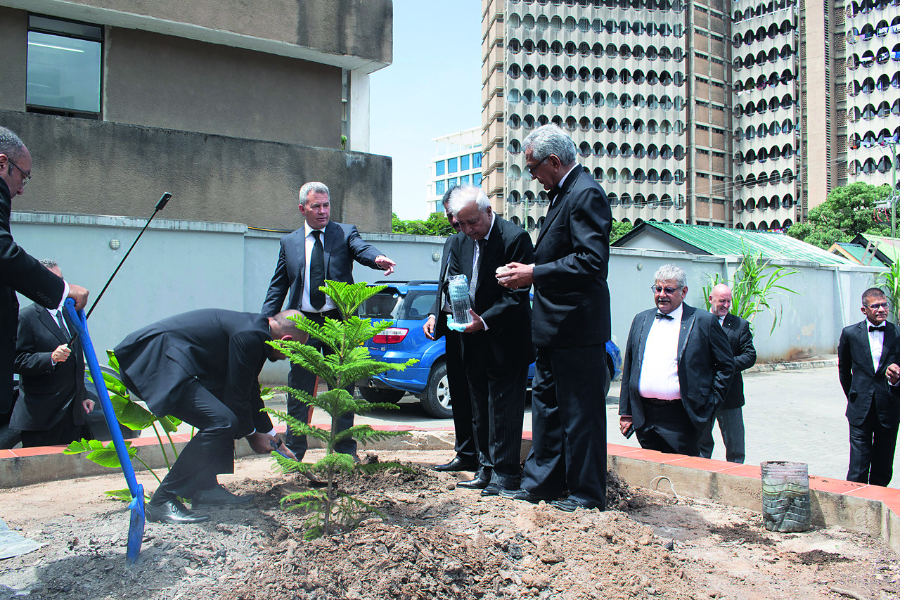 The District Grand Master planting two trees