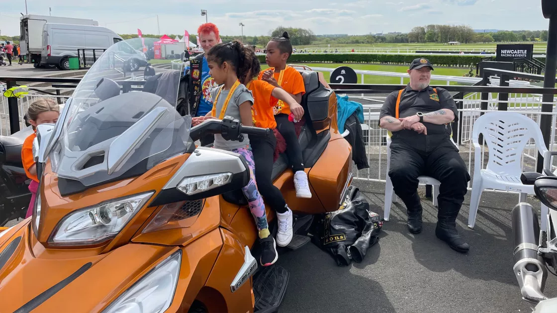 Children enjoying the display of motorbikes after the fun run