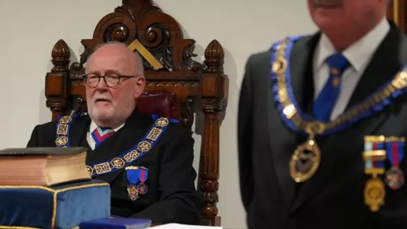 Owen Davies sat in an ornate throne-like chair