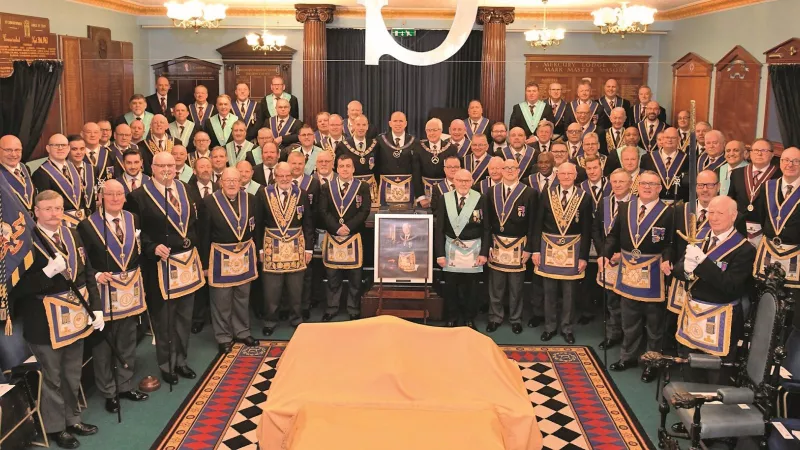 Hampshire and Isle of Wight Freemasons wearing regalia in a Lodge room